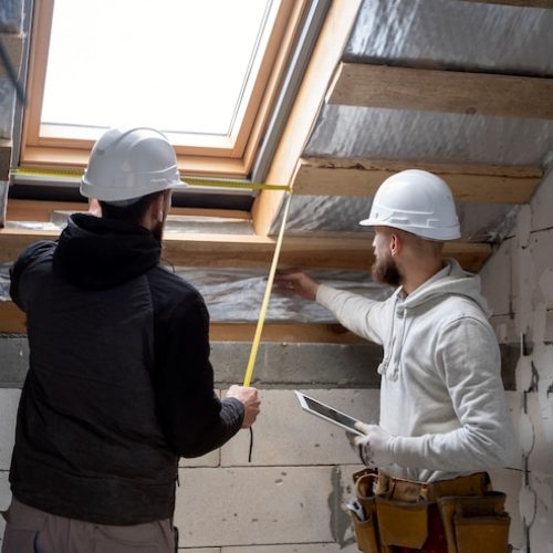 medium-shot-people-working-with-helmets_23-2149343697